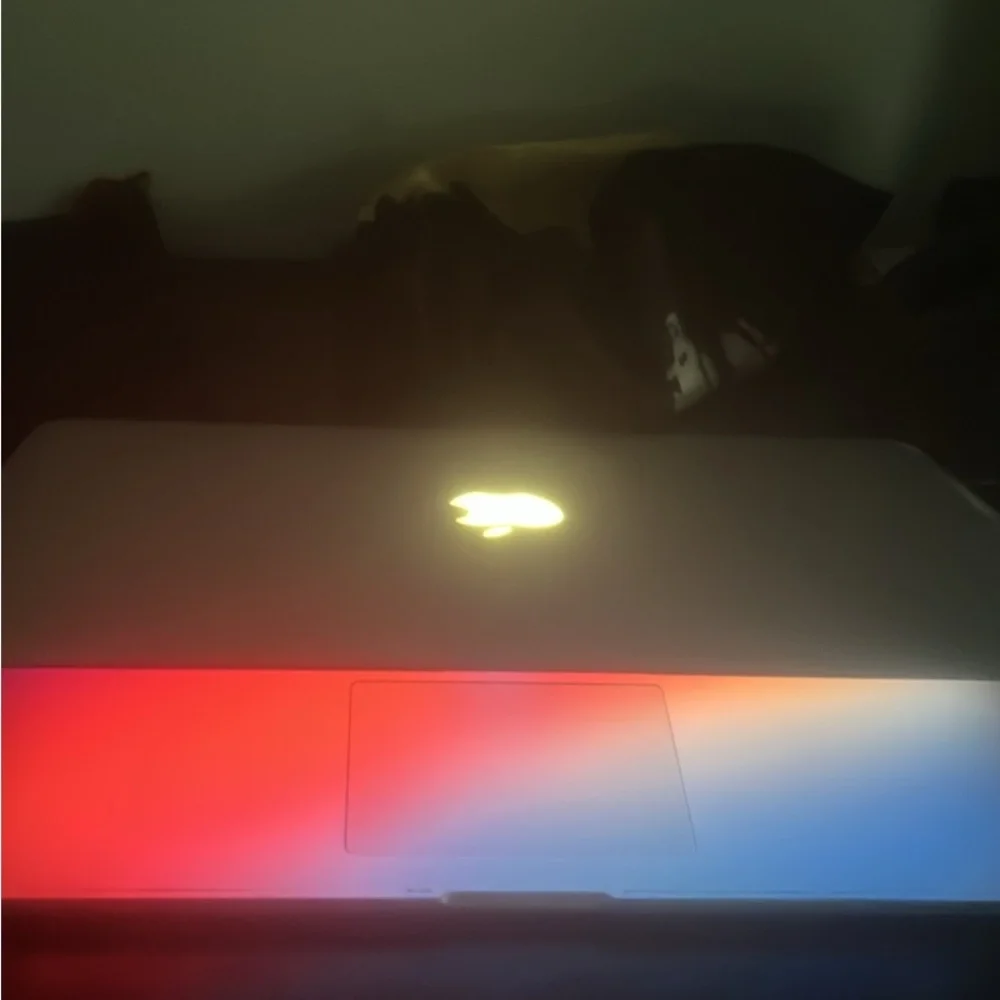 Apple Laptop with Red and Blue Keyboard Glow